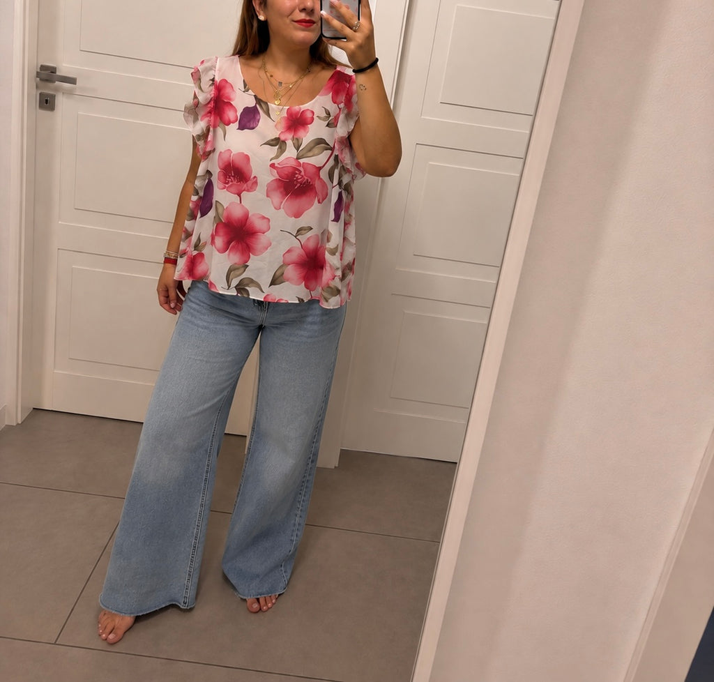 Blusa floreale con volant sulle spalle